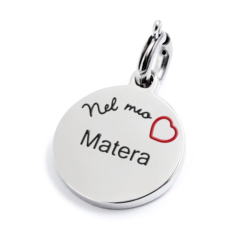 S.STEEL CHARM MATERA S.steel round charm with Matera city's symbols image, 14 mm diameter. On the front side lettering in black S.STEEL CHARM MATERA S.steel round charm with Matera city's symbols image, 14 mm diameter. On the front side lettering in black