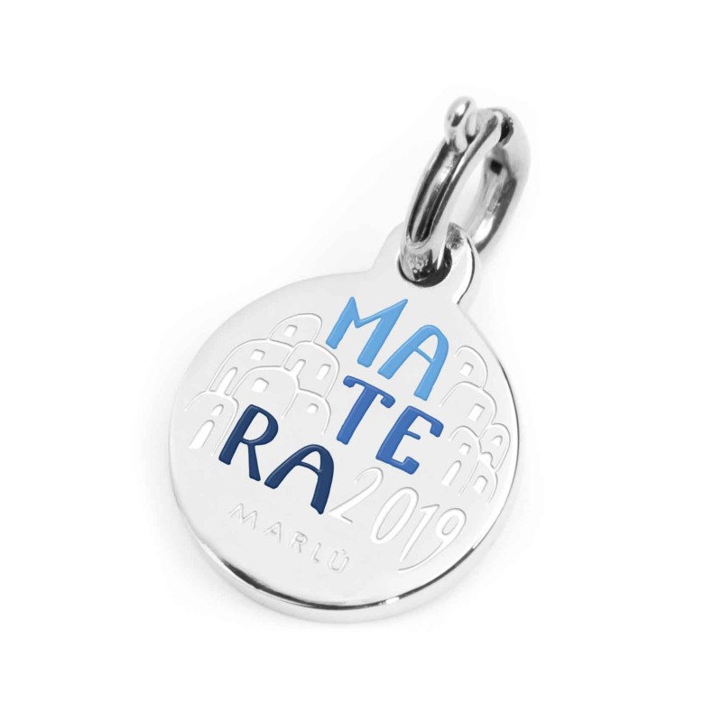 S.STEEL CHARM MATERA 2019 S.steel round charm with Matera 2019 city's symbols image, 14 mm diameter. On the front side lettering S.STEEL CHARM MATERA 2019 S.steel round charm with Matera 2019 city's symbols image, 14 mm diameter. On the front side lettering
