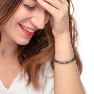 S.STEEL BR WITH LAVA STONE BEADS S.steel bracelet with lava stone beads 2,30*4,30 mm on the sides. In the center alternated poli