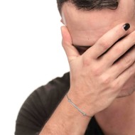 S.STEEL BR WITH WHITE CZ STONE AND BAGUETTE S.steel bracelet with cutting cross chain, 1,20 mm width, 0,26 mm thickness. On the