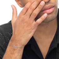 S.STEEL BR WITH INFINITY WITH CZ STONE S.steel bracelet with cutting cross chain, 1,20 mm width, 0,26 mm thickness. On the cente S.STEEL BR WITH INFINITY WITH CZ STONE S.steel bracelet with cutting cross chain, 1,20 mm width, 0,26 mm thickness. On the cente
