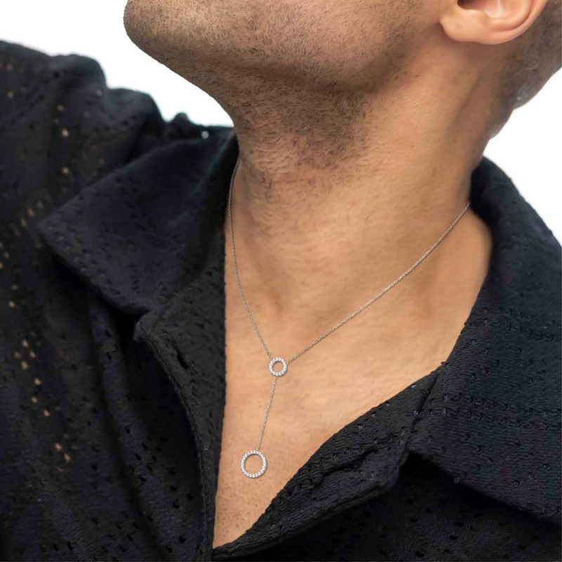 S.STEEL Y NECKLACE WITH TWO ROUND ELEMENTS S.steel Y necklace with cutting cross chain, 1 mm width, 0,26 mm thickness. On the ce S.STEEL Y NECKLACE WITH TWO ROUND ELEMENTS S.steel Y necklace with cutting cross chain, 1 mm width, 0,26 mm thickness. On the ce
