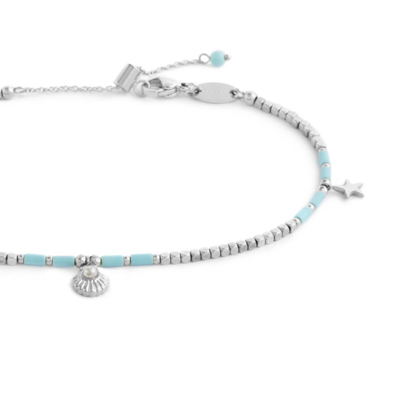 Cavigliera con ematite cubica alternata a perline conchiglia e stelle marine pendenti Cavigliera con ematite cubica alternata a perline conchiglia e stelle marine pendenti