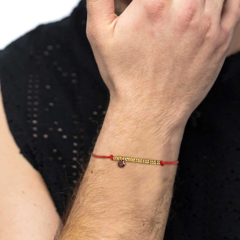 Bracciale cordino con elementi acciaio e zircone pendente