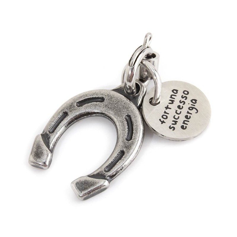 BURNISHED STEEL HORSESHOE CHARM Burnished steel charm in the shape of a horseshoe 13 X 18 mm and round tag with the words "Fortu BURNISHED STEEL HORSESHOE CHARM Burnished steel charm in the shape of a horseshoe 13 X 18 mm and round tag with the words "Fortu