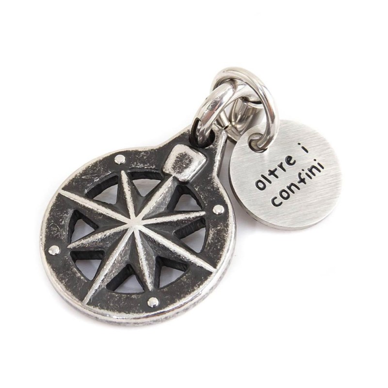 BURNISHED STEEL COMPASS CHARM Burnished steel compass charm 15 X 18.50 mm and round tag with the words "Fortune, success, energy BURNISHED STEEL COMPASS CHARM Burnished steel compass charm 15 X 18.50 mm and round tag with the words "Fortune, success, energy