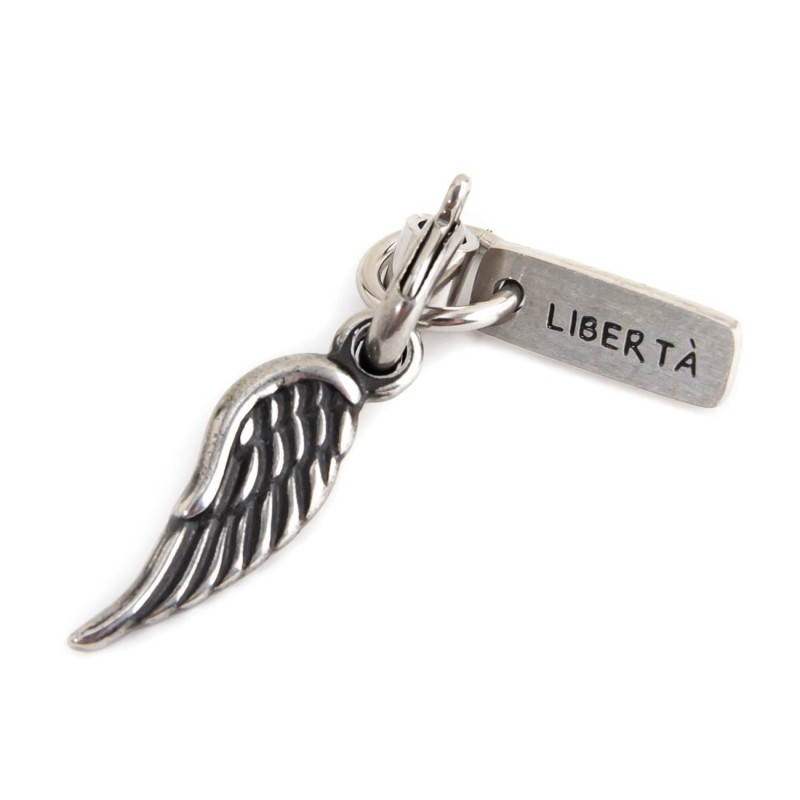 BURNISHED WING CHARM Burnished steel charm in the shape of a wing and rectangular tag with the word "Libertà"Man Class 27 Col BURNISHED WING CHARM Burnished steel charm in the shape of a wing and rectangular tag with the word "Libertà"Man Class 27 Col